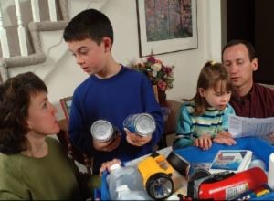 Photo of a family preparing a safety kit