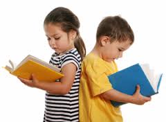 Photo of 2 kids reading books