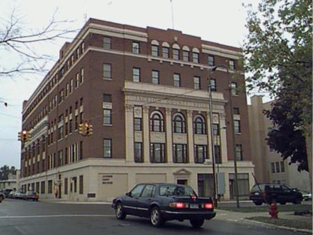 Courthouse with car passing by